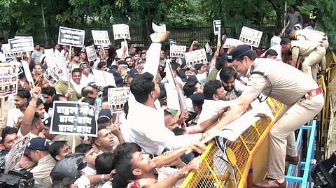 Tension flared in the Uttarakhand capital on Wednesday as BJP workers marched towards the state Congress headquarters to protest against Opposition leader Rahul Gandhi's demonstration near the Prime Minister's residence.