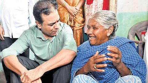 BRS working president KT Rama Rao interacts with a woman party worker at Rangapet village in Luxettipet mandal of Mancherial district on Tuesday.