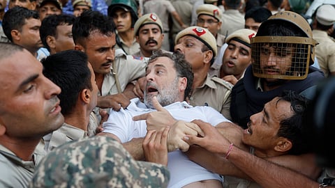 Police personnel detain Leader of Opposition in the Lok Sabha Rahul Gandhi during a sit-in protest near the Prime Ministers residence over alleged irregularities in the NEET examination, in New Delhi, Tuesday, July 21, 2026.