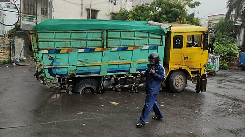 A truck stuck which was after the road caved in Surat due to heacy rainfall.