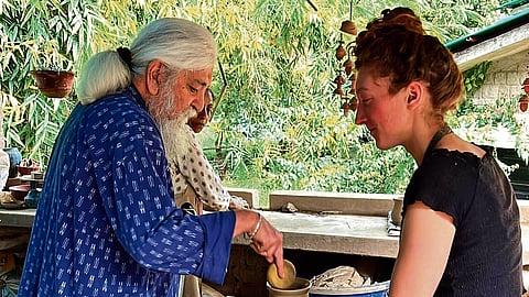 Mansimran ‘Mini’ Singh guiding a sculptor