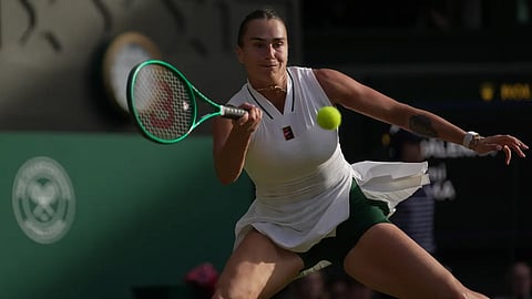 Aryna Sabalenka of Belarus returns the ball to Naomi Osaka of Japan in their fourth round women's singles match at the Wimbledon Tennis Championships in London, Sunday, July 5, 2026.