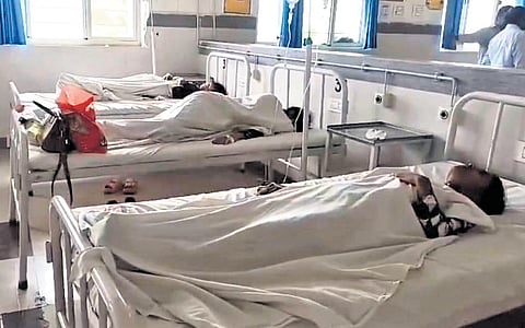 Students of Mahatma Jyotiba Phule School receive treatment at a hospital after falling ill following a meal served at the school hostel in Bellampalli, Mancherial.
