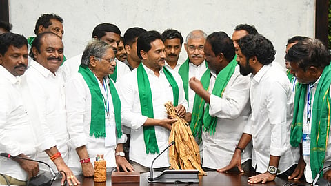 Former CM Jagan Mohan Reddy interacts with tobacco farmers on Wednesday.
