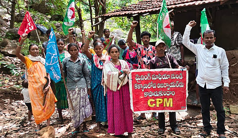 Tribals stage a protest on Wednesday demanding that Kalyanapulova reservoir in Anakapalli district be declared a ‘No-Mining Zone’.