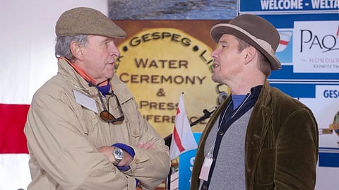 Actor Ethan Hawke, right, talks with Charles Gaines as they attend the Mi’kmaq community’s water ceremony on the shores of Pomquet Harbour to support the aboriginal call for a moratorium on oil and gas exploration in the Gulf of St. Lawrence, near Antigonish, Nova Scotia, on Oct. 26, 2015.