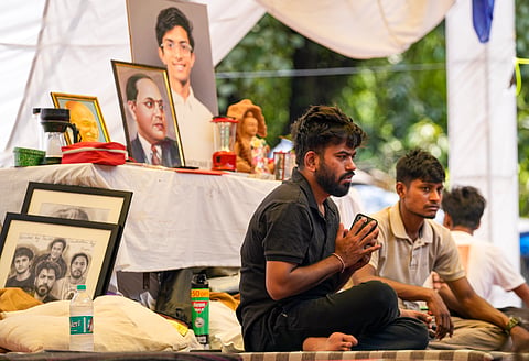  Cockroach Janta Party (CJP) founder Abhijeet Dipke during a protest demanding the resignation of Union Education Minister Dharmendra Pradhan over alleged irregularities in the NEET examination, in New Delhi.
