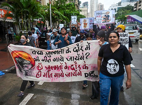 Protestors gather in support of Cockroach Janta Party and demand Union Education Minister Dharmendra Pradhan's resignation, near Shivaji Park in Mumbai, Wednesday, July 22, 2026