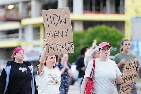 Protesters march after a Madison police officer shot and killed a man Wednesday, July 22, 2026, in Madison, Wis.