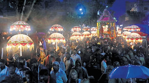 The streets around Balkampet were packed with devotees, many of whom braved the rain to witness the spectacle.