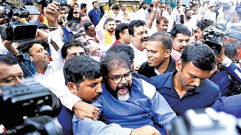 BJP leaders and workers, including Leader of Opposition in Karnataka Legislative Council Chalavadi Narayanaswamy, protest near KPCC office in Bengaluru on Wednesday.
