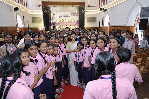 Women and Child Development Minister Bindhu Krishna with beneficiaries of ‘Collector’s Super 100’ at the Mahatma Ayyankali Hall on Wednesday