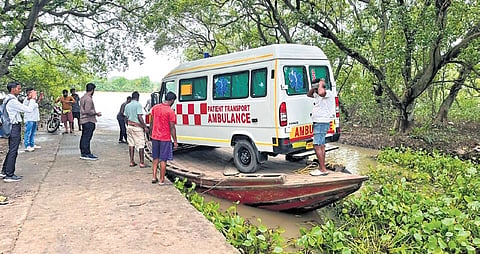 The ambulance van arriving at Batighar Panchayat on a boat  