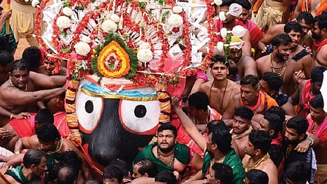 Lord Jagannath being taken on Pahandi during Bahuda Yatra