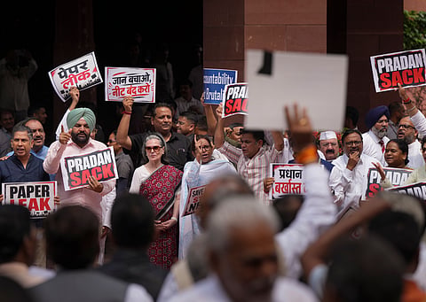 Congress MPs Sonia Gandhi, Varsha Gaikwad and Hibi Eden and others raise slogans during a protest by opposition leaders demanding resignation of Union Education Minister Dharmendra Paradhan over the NEET paper leak issue, amid the ongoing Monsoon session of Parliament, in New Delhi, Thursday, July 23, 2026.
