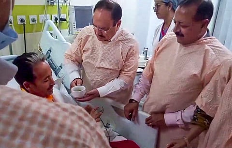 Union Health Minister JP Nadda offers a drink to social activist and educator Sonam Wangchuk as Union Minister of State Jitendra Singh looks on during the breaking of Wangchuk's 26-day indefinite hunger strike, at Medanta Hospital, in Gurugram.