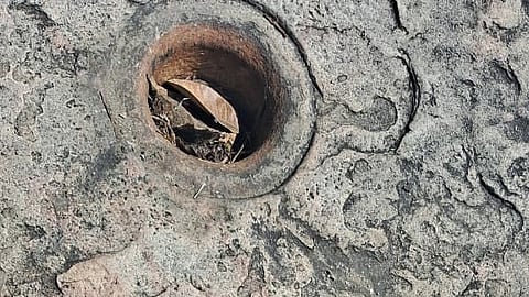 The Kakkuly pit on a rock, used by people of Anchunad for pounding rice, in Kanthalloor