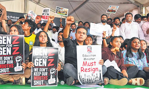 BRS working president KT Rama Rao raises slogans during a protest at Dharna Chowk in Hyderabad on Friday