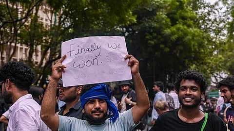 People celebrate after Union Education Minister Dharmendra Pradhan resigned and took responsibility for the NEET paper leak at Jantar Mantar in New Delhi, Saturday, July 25, 2026.