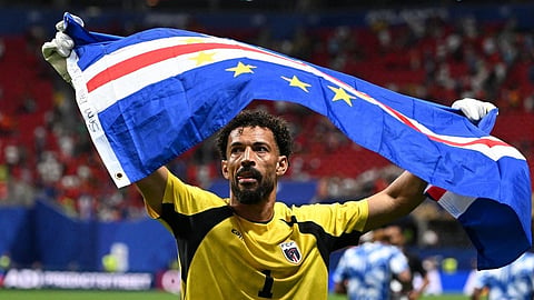 Cape Verde's goalkeeper, Vozinha, celebrates with his national flag at the end of the 2026 World Cup Group H football match between Spain and Cape Verde at Atlanta Stadium in Atlanta on June 15