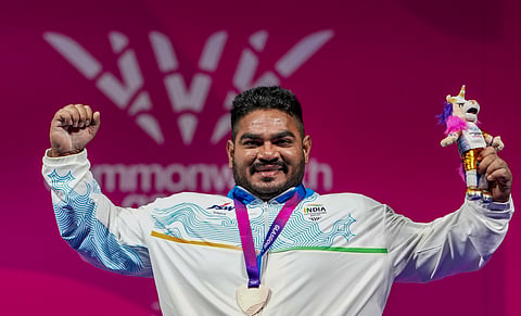 Jhandu Kumar rejoices after capturing the bronze medal on Friday