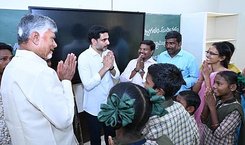 CM Nara Chandrababu Naidu and Minister for HRD and IT Nara Lokesh during Mega Parents-Teachers meeting at Rampachodavaram in Polavaram district on Friday. 
