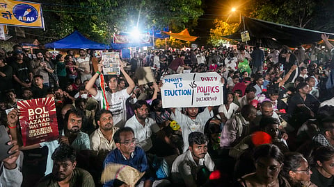 People participate in a protest against the alleged NEET-UG paper leak and examination irregularities at Jantar Mantar, in New Delhi, Friday, July 24, 2026. 