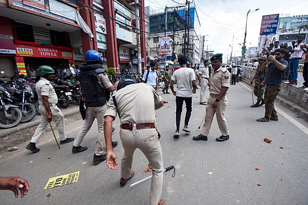 Police personnel clash with students protesting during the Bihar bandh over the alleged NEET-UG paper leak at Exhibition Road in the Patna district of Bihar on Saturday, July 25, 2026.