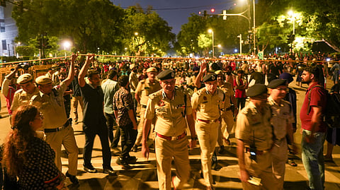 Police personnel at the site during the ongoing protest by Cockroach Janta Party (CJP) demanding the resignation of Union Education Minister Dharmendra Pradhan over the NEET paper leak issue, at Jantar Mantar, in New Delhi, late Friday, July 24, 2026.