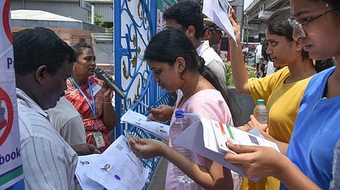 Students appear for the NEET exam at an examination centre.