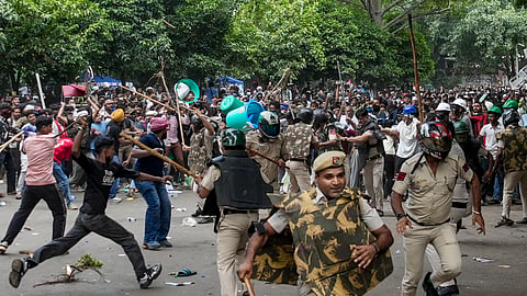  Chaos erupted at the site amid the ongoing protest of Cockroach Janta Party (CJP) demanding the resignation of union education Minister Dharmendra Pradhan over the NEET paper leak issue, at Jantar Mantar, in New Delhi, Saturday, July 25, 2026
