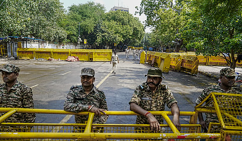  Security personnel keep a vigil near the protest site of Jantar Mantar, in New Delhi on July 26, 2026.