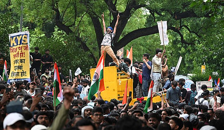 Cockroach Janata Party (CJP) supporters raise slogans as they gather ahead of a protest march at the Jantar Mantar in New Delhi.