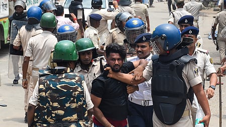 Police personnel resort to a lathi charge on students protesting during the Bihar bandh called by left-wing student organisations over the alleged NEET-UG paper leak at Exhibition Road in the Patna district of Bihar on Saturday, July 25, 2026. 