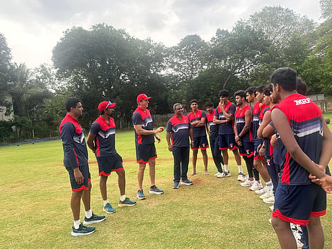 Glenn McGrath (3rd from L) and chief coach of MRF Pace foundation M Senthilnathan (4th from L) with the pacers