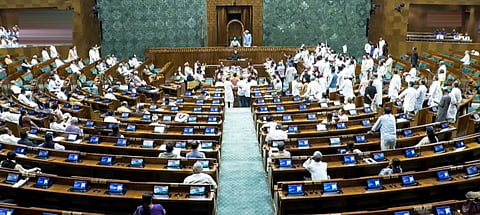  Opposition MPs stage a protest in the Lok Sabha during the Monsoon session of Parliament, in New Delhi, Monday, July 27, 2026. 