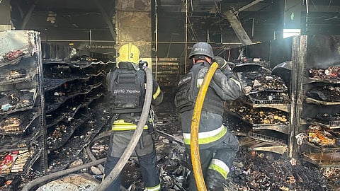 In this photo provided by the Ukrainian Emergency Service, firefighters put out a fire in a supermarket following a Russian drone attack in Chernihiv, Ukraine, Sunday, July 26, 2026. 