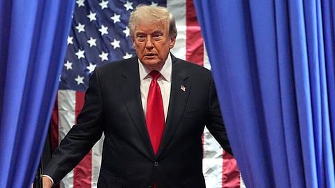 President Donald Trump arrives to speak at General Motors proving ground, Monday, July 27, 2026, in Milford, Mich.