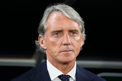 Saudi Arabia’s head coach Roberto Mancini stands for the national anthems ahead of the Asian Cup Group F soccer match between Saudi Arabia and Thailand at Education City Stadium, in Al Rayyan, Qatar, Thursday, Jan. 25, 2024. 