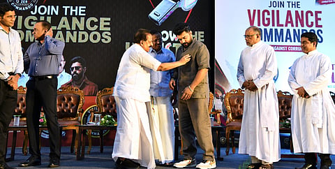 Home and Vigilance Minister Ramesh Chennithalath conferring the Vigilance Commando badge on him to actor Nivin Pauly.
