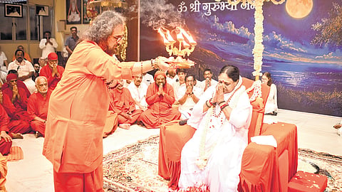 Swami Amritaswarupananda Puri performs Guru Pada Puja during the Guru Purnima celebrations at Amritapuri in Kollam on Wednesday