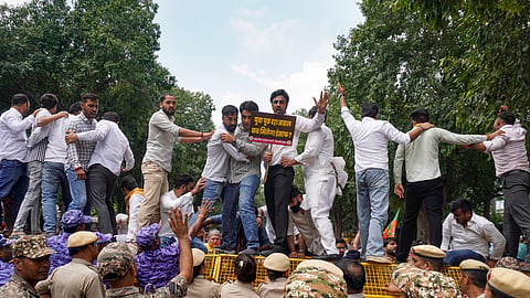 BJP supporters stage a protest at the Aam Aadmi Party office demanding the resignation of Punjab Education Minister Harjot Singh Bains over alleged paper leaks in the state, in New Delhi, Thursday, July 30, 2026.