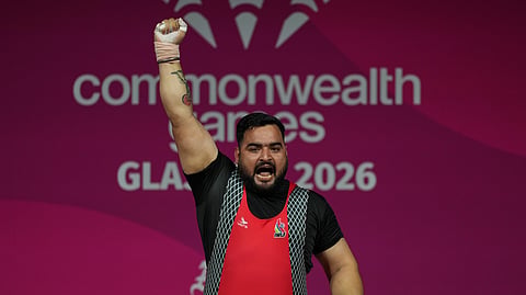 Lifter Loverpreet Singh celebrates after setting a Games record in Glasgow on Thursday