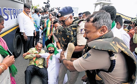 Police detain BJP MLC CT Ravi and others when party leaders and workers tried to enter the KRS reservoir premises on Friday 