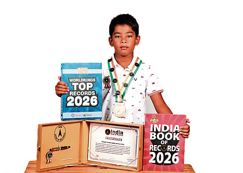 Ishank Singh with his certificates and records