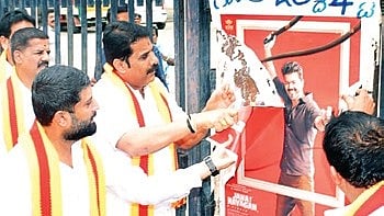 Kannada activists tear down a poster of ‘Jana Nayagan’ in Mandya on Thursday 