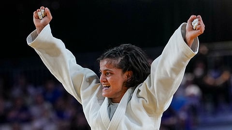 Indian judoka Asmita Dey celebrates her win in Glasgow on Friday