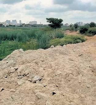 Debris dumped on the northern side of the 500-acre Yele Mallappa Chetty Lake 