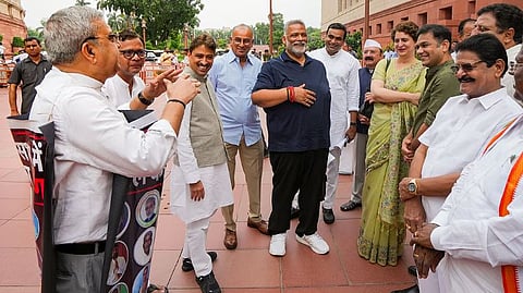 TMC MP Kalyan Banerjee stage a protest as Congress MPs Priyanka Gandhi Vadra, Imran Masood, MP Pappu Yadav and others look on during the Monsoon session of Parliament, in New Delhi, Thursday, July 30, 2026.