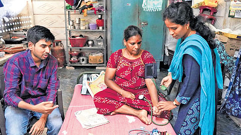 Dr S Mohan & the Sanjeevan Palliative Care team visit a patient in Puducherry; (right) Nurses inquiring about the health condition of a woman 